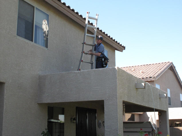 Keith locates the best spot for the dish antenna.
