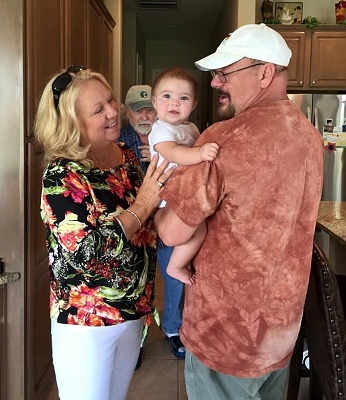 Louise meets Gianna; Mikey photobombing.