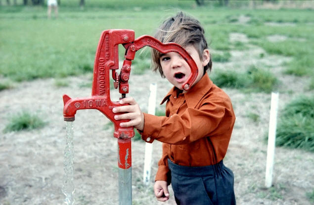John explores a water spigot: 1981 (4 1/2 years)