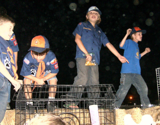 Zach and his friends enjoy climbing a haystack.