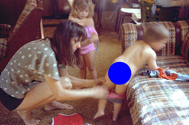 Mary helps Jenny and Johnny get into swimwear.
