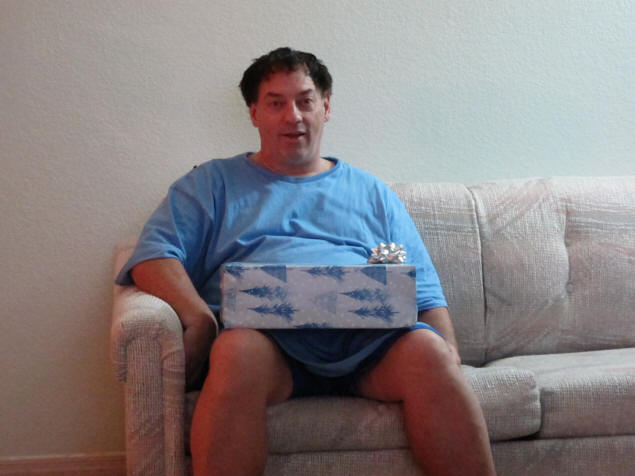 Michael tries to see one of his presents.