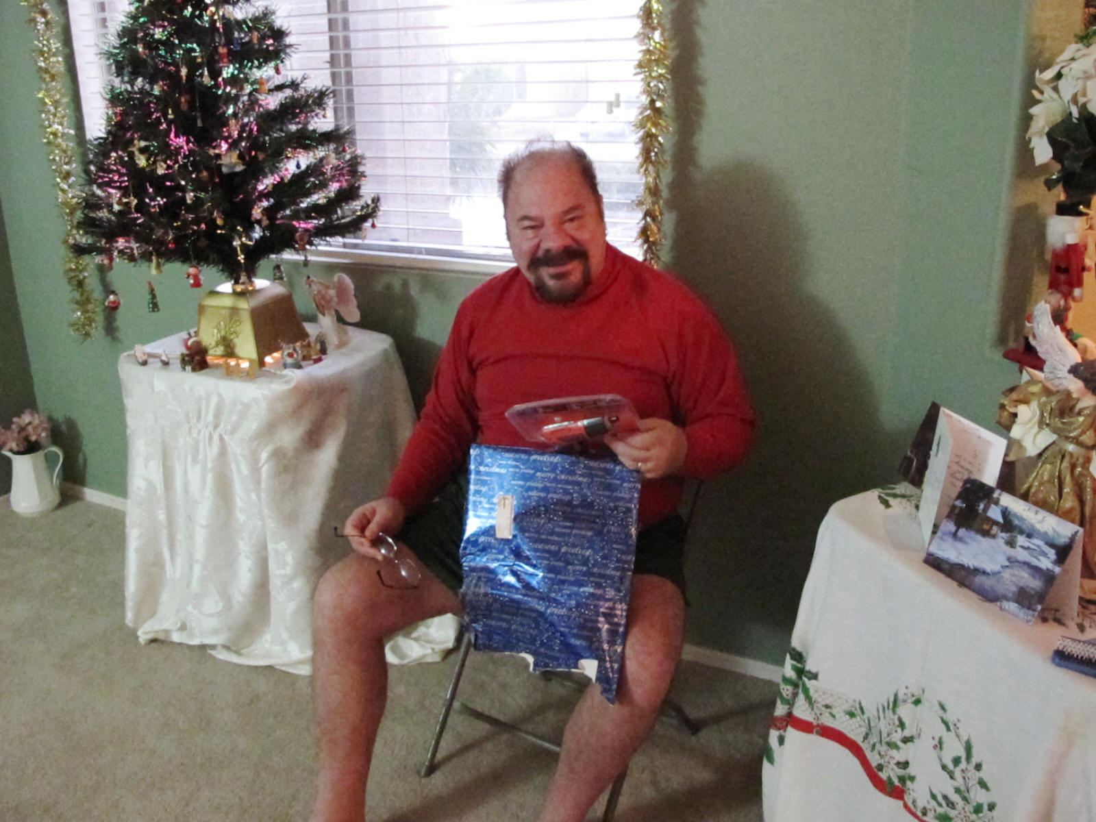 Paul tries to see HIS presents.