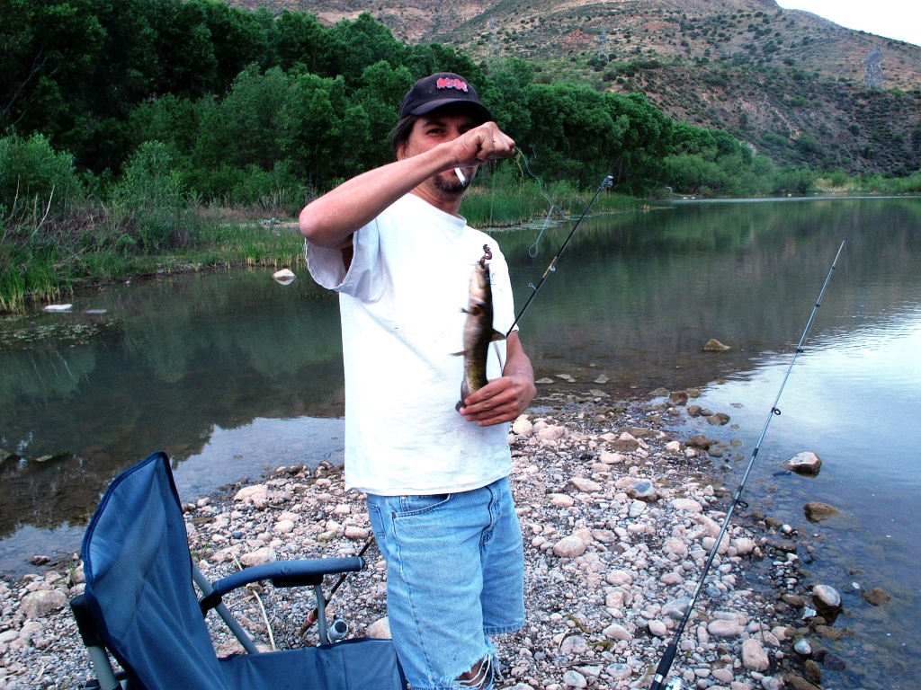 Carl lands a fish.
