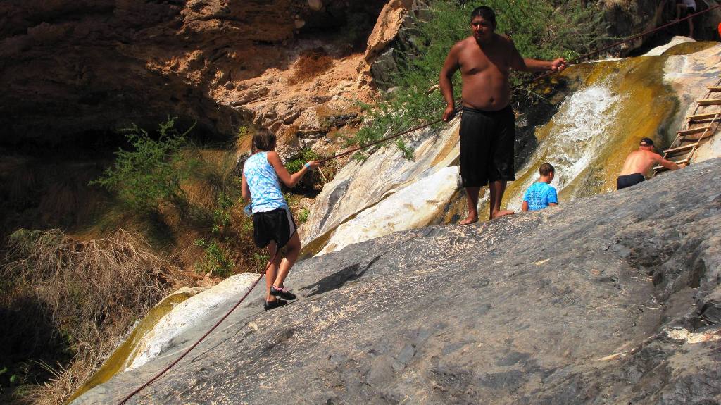 Patricia on the rope to Travertine Falls.