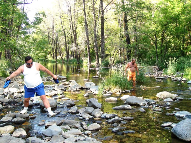 Michael and Paul ford our way downstream. Michael is HOLDING his river shoes.
