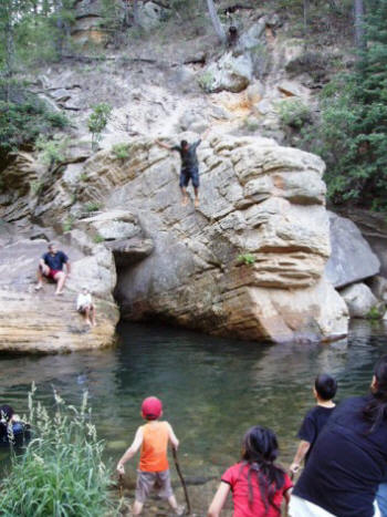 A kid demonstrates proper jumping technique.