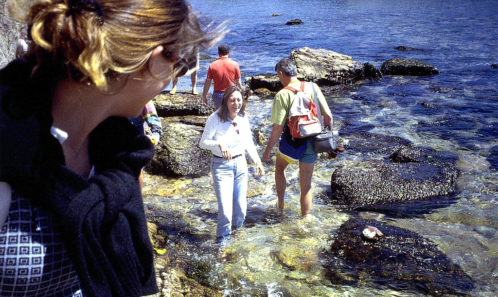 Mary gets her feet wet as Karen looks on.