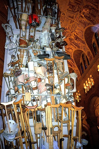 Discarded crutches decorate a wall in St. Anne's church.