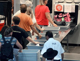 Flat Stanley going through airport security.