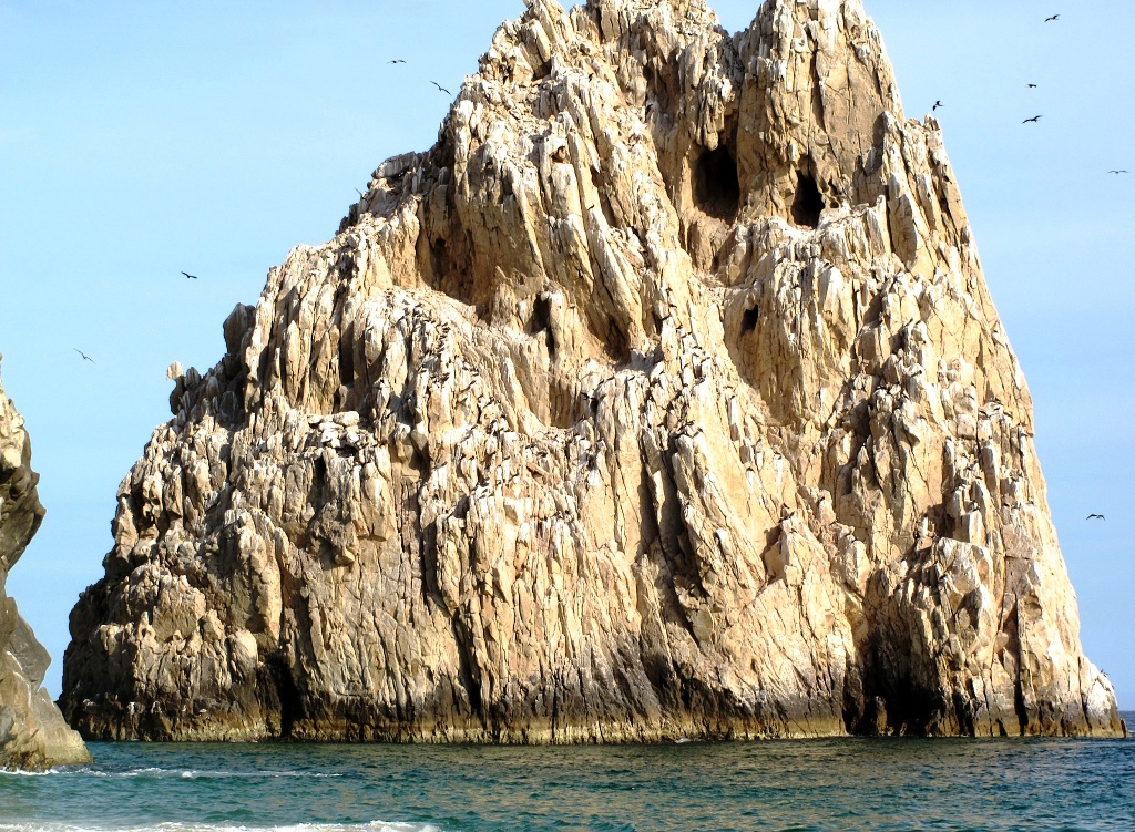 A massiff juts from the water, hemming in the south side of Divorce Beach.