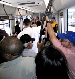 Riding the light rail to the Sun Devil Stadium.
